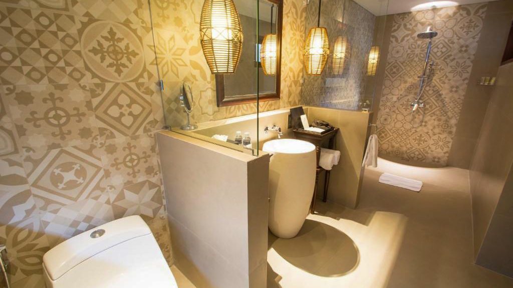 Luxurious bathroom at Lembongan Beach Club & Resort with patterned walls and stylish lighting.