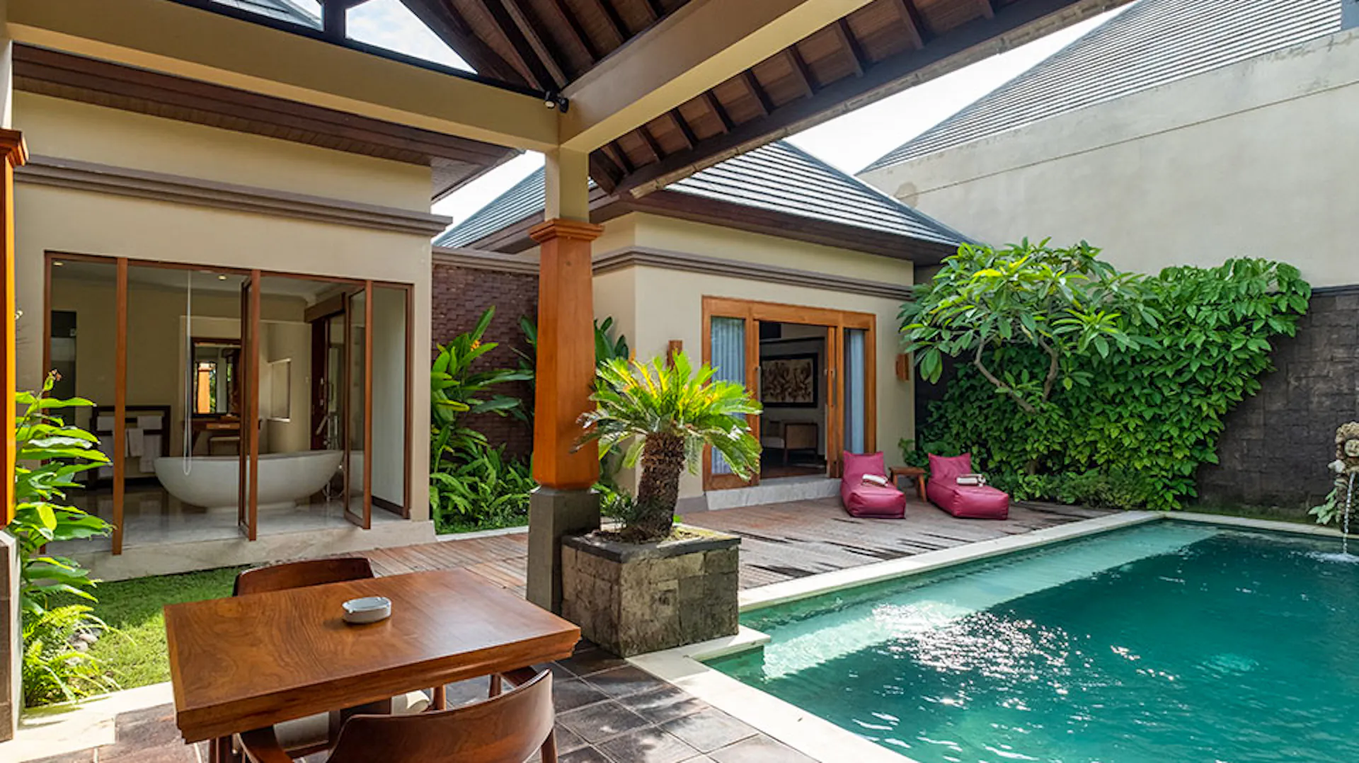 A beautiful private villa in Lovina, Bali, with a swimming pool, outdoor lounge, and dining area.