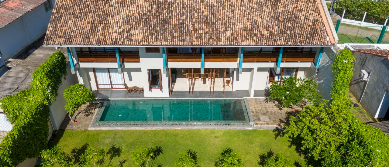 Aerial view of Sitara Villa in Weligama, a serene retreat with a sparkling pool and lush garden.