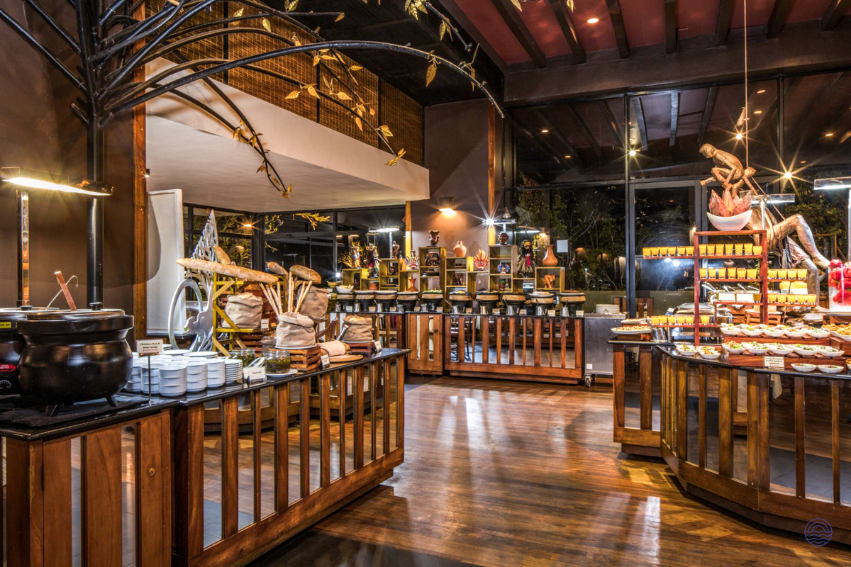 An elegant buffet restaurant at Heritance Kandalama, Sri Lanka, featuring a wide array of delicious food.