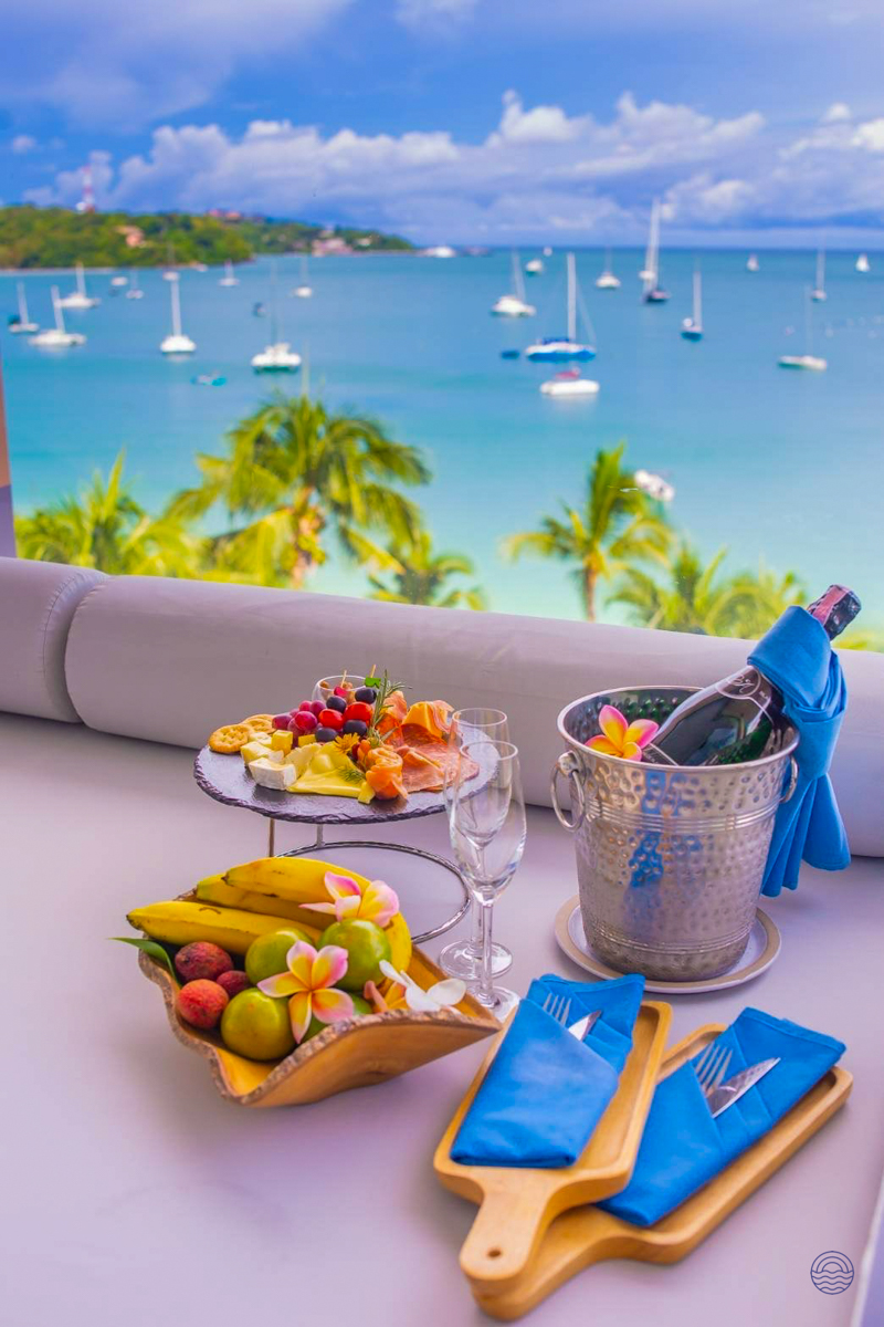 Enjoy a luxurious welcome spread of champagne, fruit, and snacks overlooking Phuket's beautiful bay.
