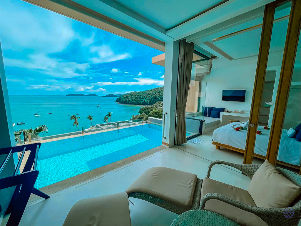 Luxurious pool villa overlooking the stunning blue ocean and tropical islands in Phuket, Thailand.