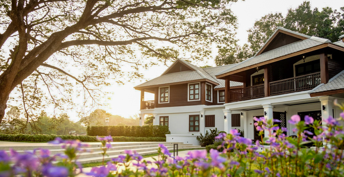 Elegant traditional Thai resort in Chiang Mai, featuring beautiful architecture and serene gardens at sunset.