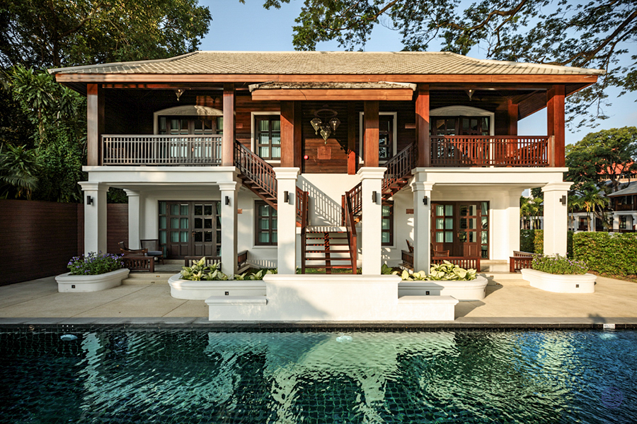 A stunning historical resort in Chiang Mai, featuring traditional Thai architecture and a serene swimming pool.