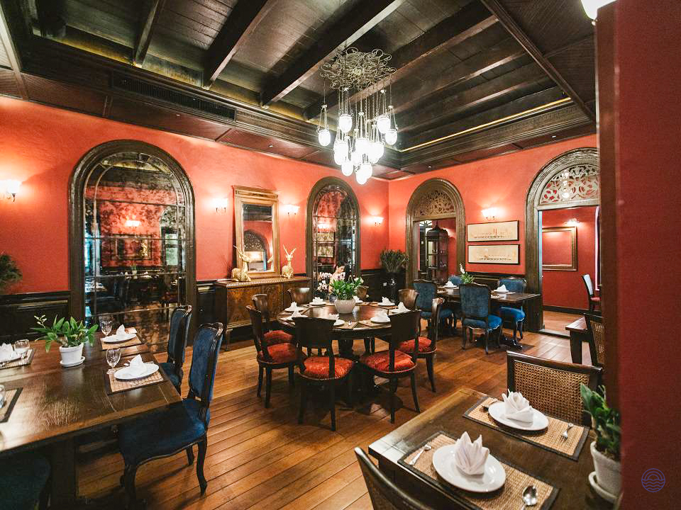 Experience an authentic Thai welcome dinner in this elegant dining room in Bangkok.