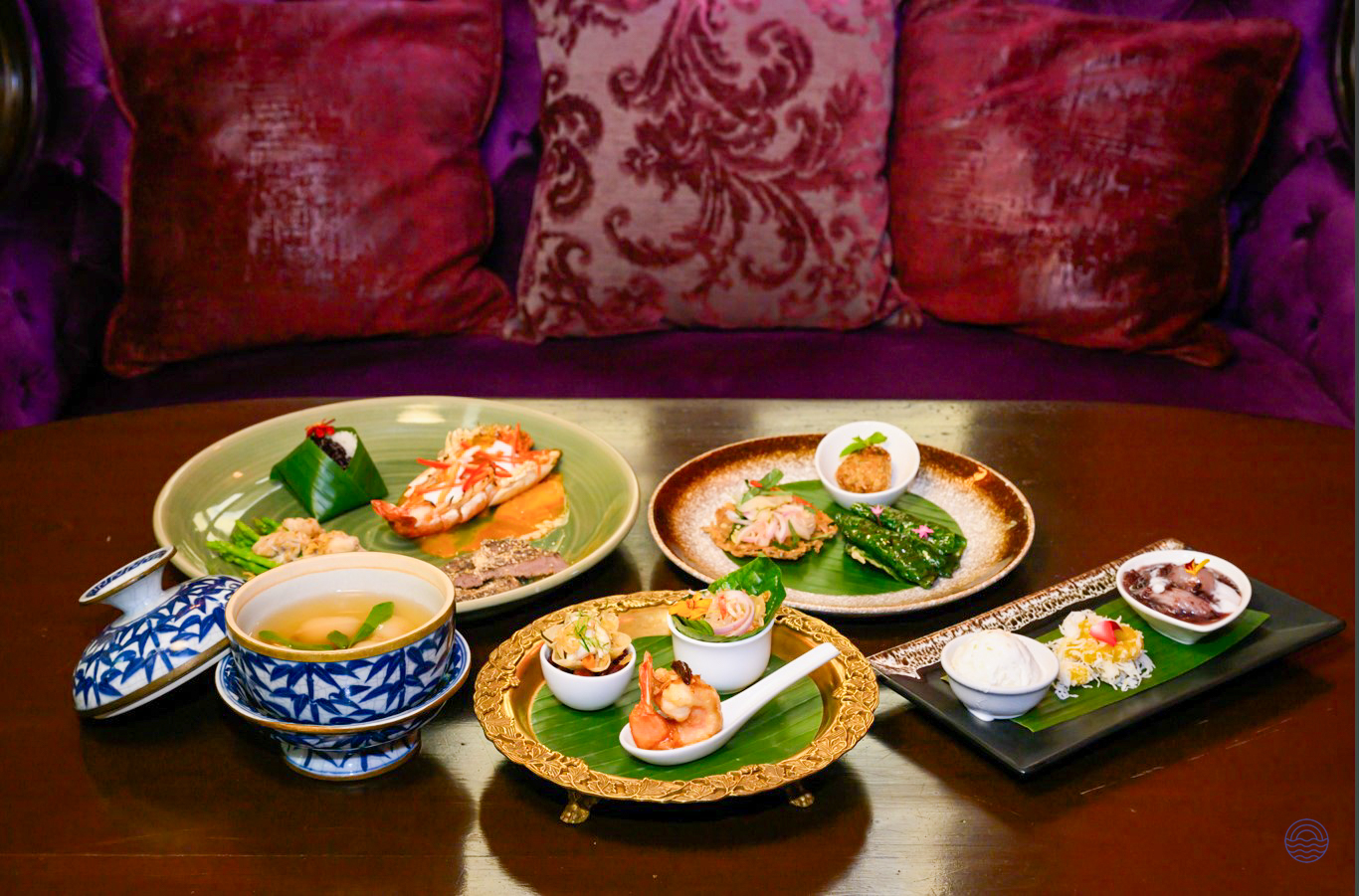 An authentic Thai welcome dinner featuring exquisite dishes beautifully arranged on a table in Bangkok.