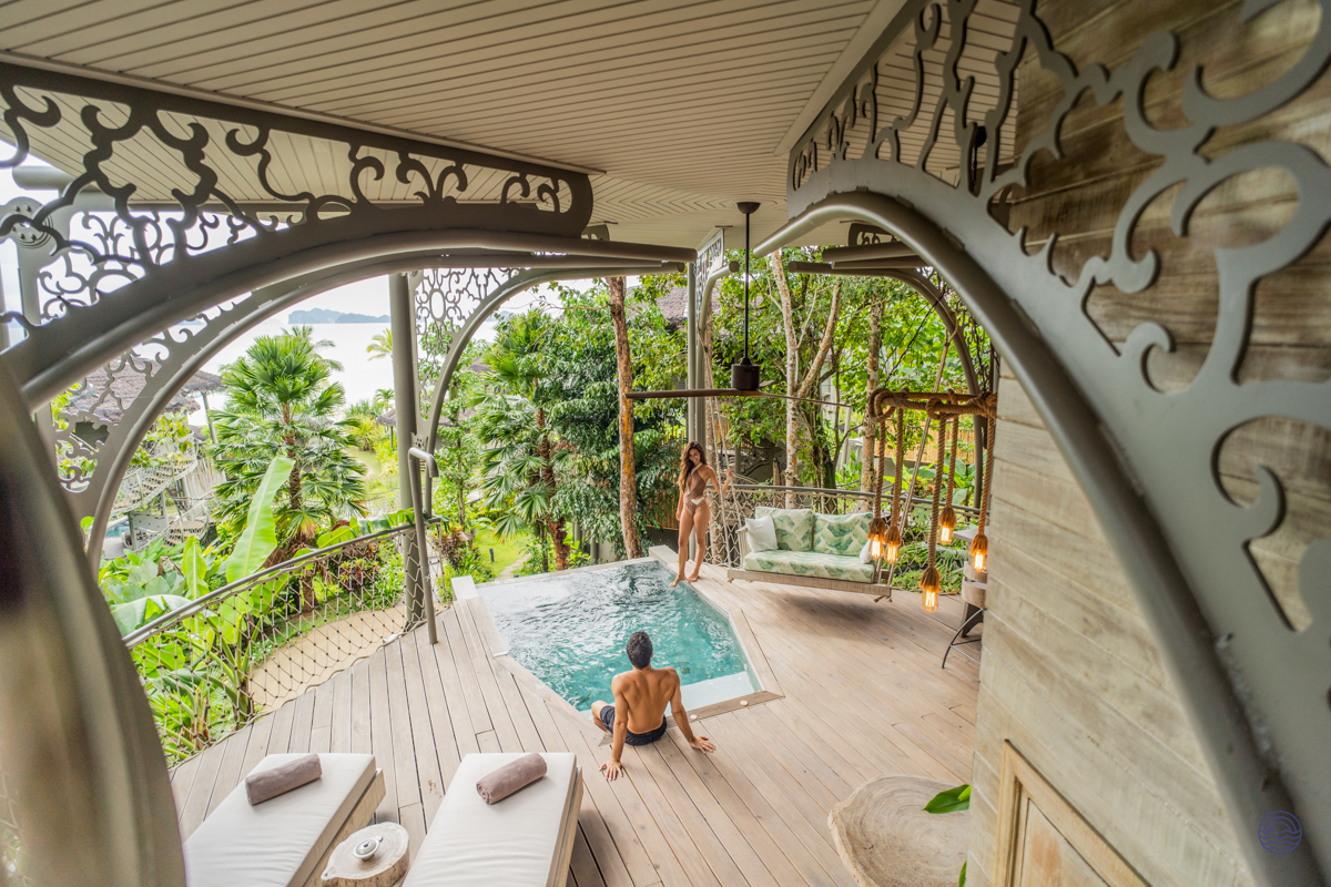 Couple enjoying a private infinity pool and deck at a luxurious treehouse villa in Koh Yao Noi.