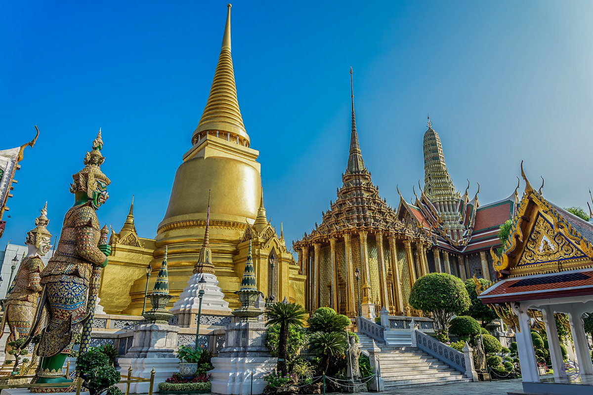 The magnificent golden spires and intricate details of the Grand Palace in Bangkok, Thailand.