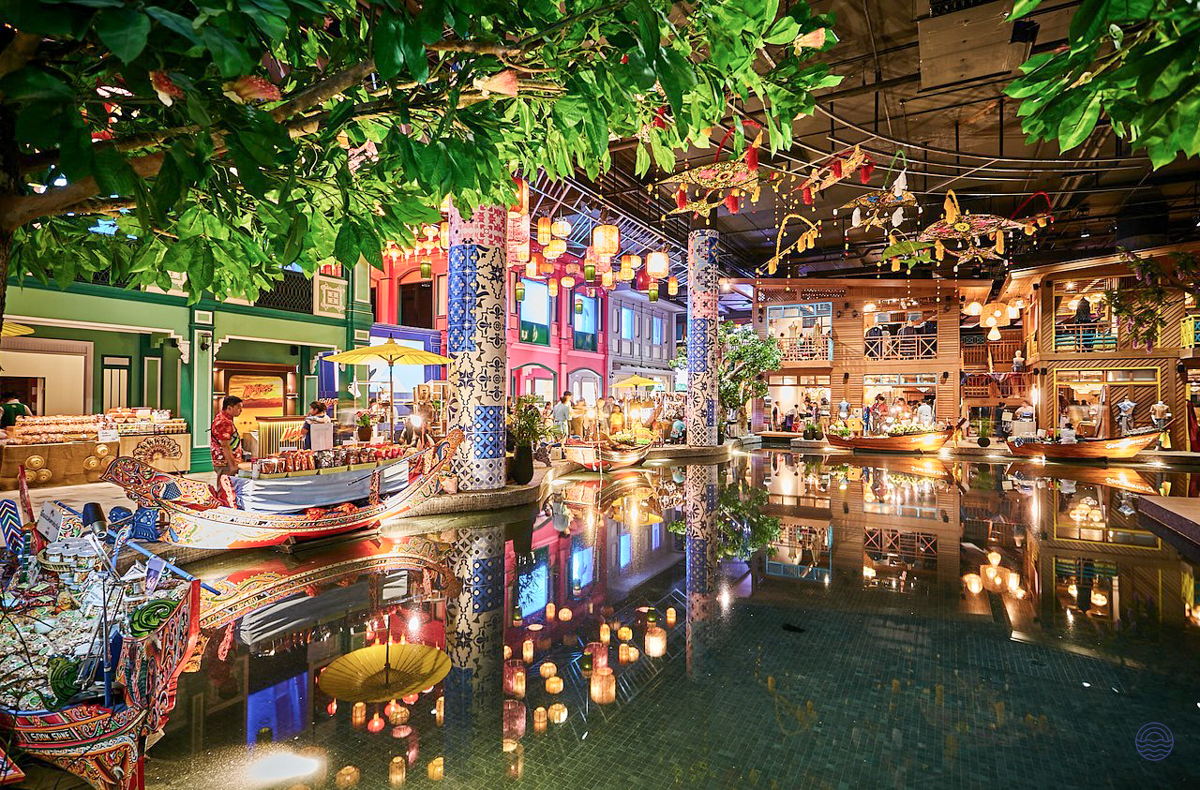 Exploring the vibrant indoor floating market at ICONSIAM in Bangkok, with colorful boats and lanterns.