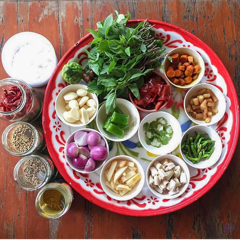 Fresh Thai cooking ingredients arranged on a tray for a hands-on class in Chiang Mai.