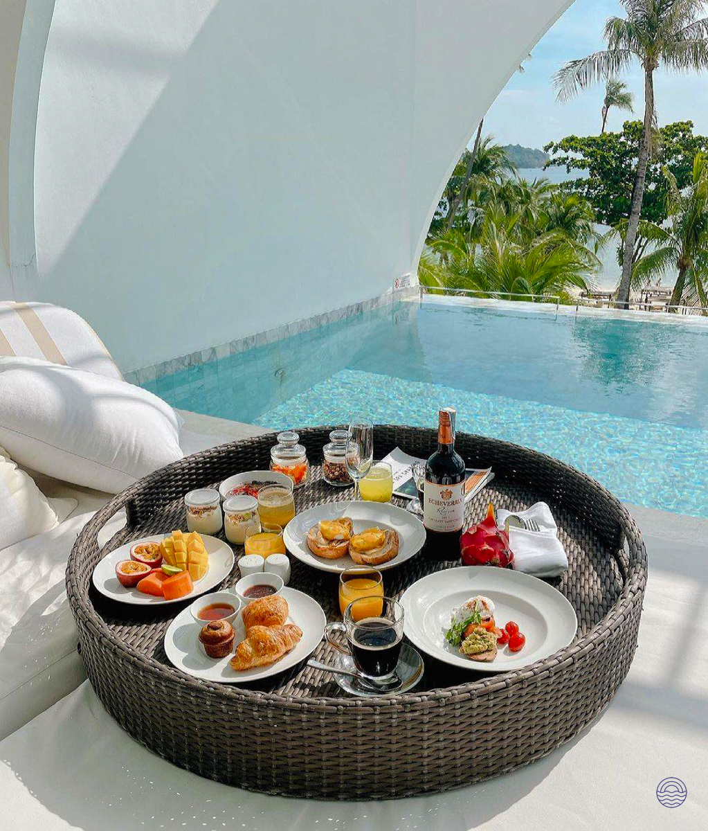 A lavish floating breakfast in a private pool overlooking the tropical beach of Koh Samui.