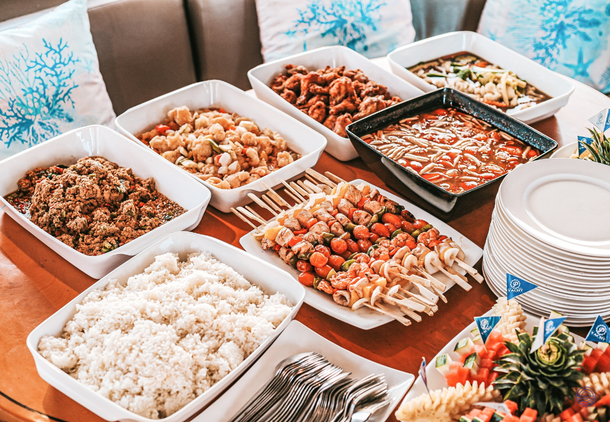 A sumptuous Thai dinner buffet with various dishes served on a sunset cruise in Phuket.
