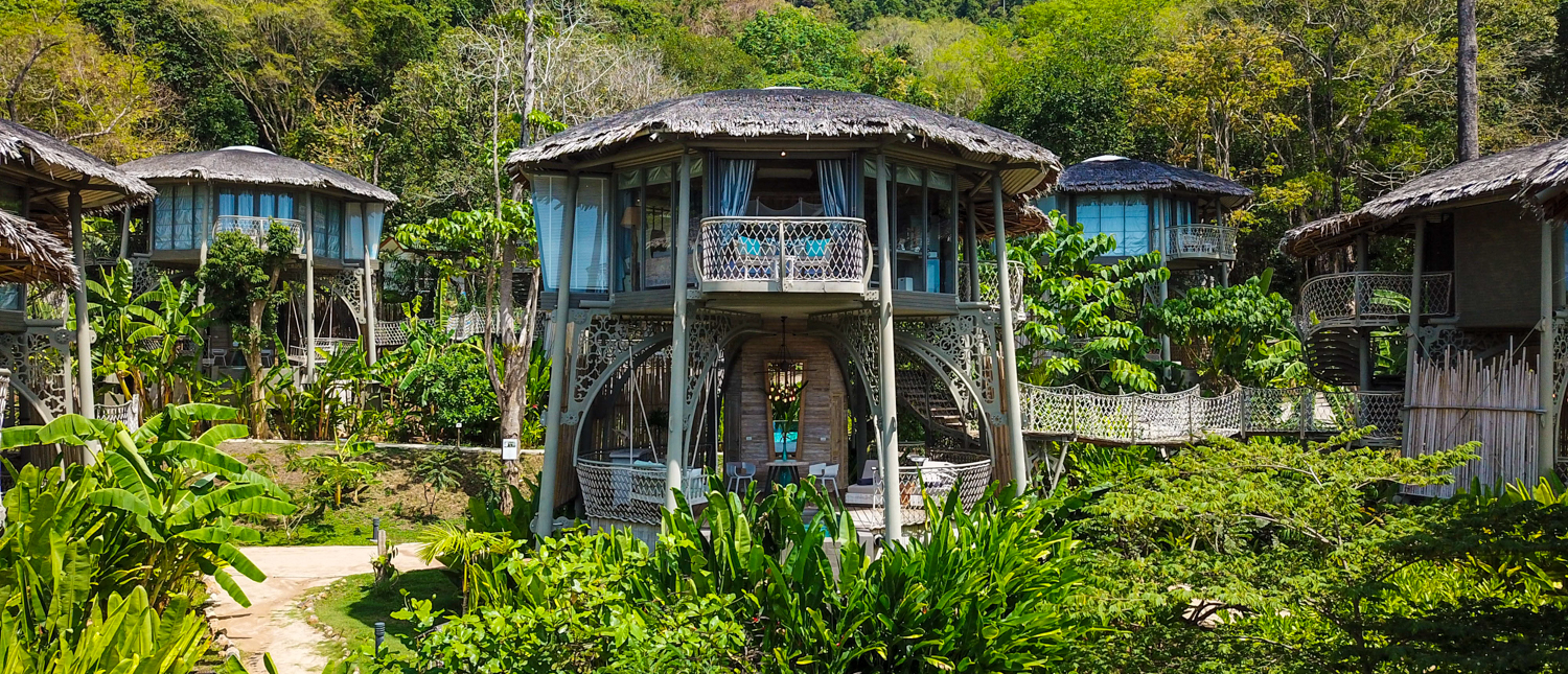 Luxurious treehouse accommodations nestled in lush tropical jungle on Koh Yao Noi, Thailand.