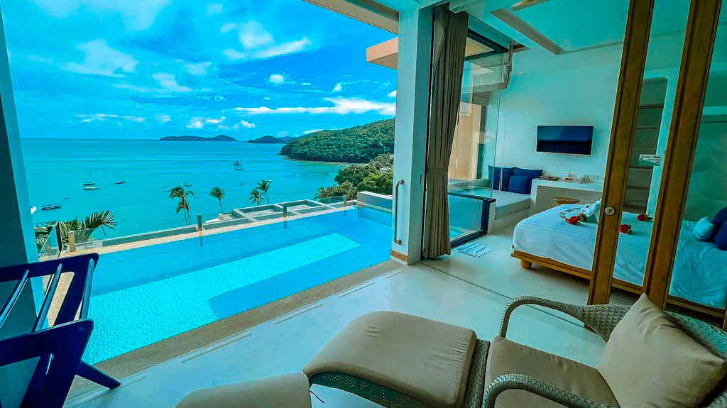 A stunning resort room with an infinity pool, ocean views, and tropical islands in Thailand.