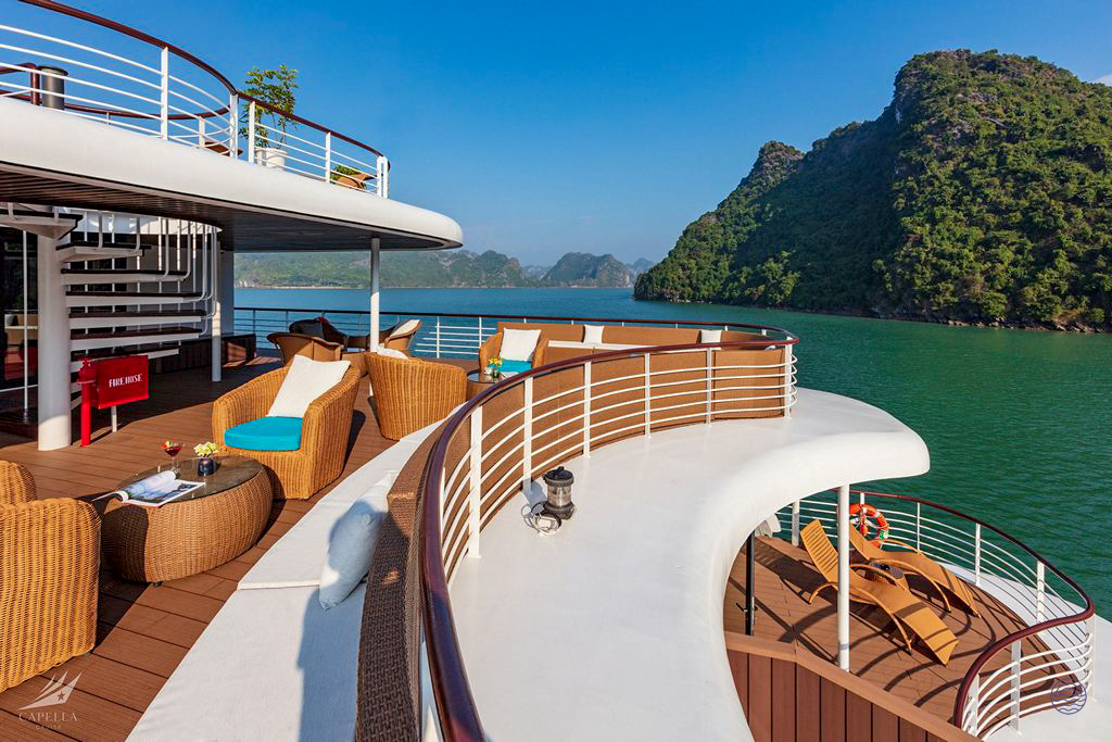 Relax on the luxurious deck of a cruise ship while exploring the stunning Halong Bay.