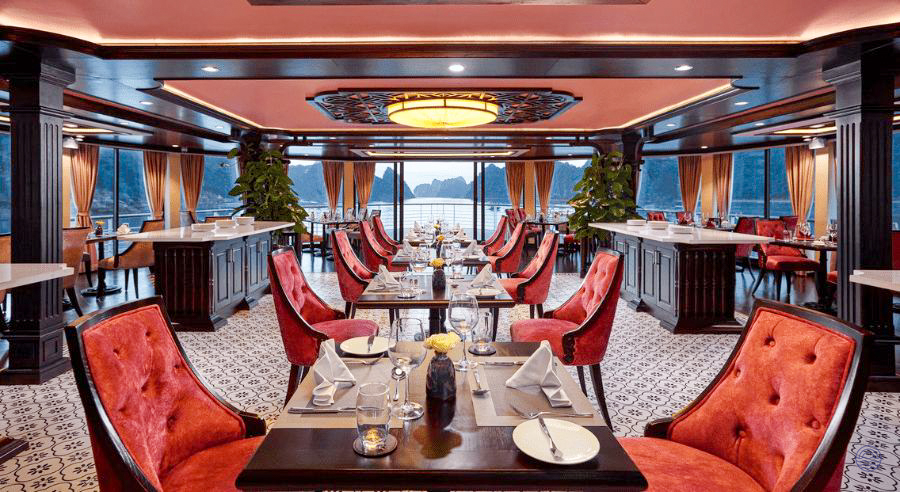 Enjoy gourmet dining in the elegant Capella Cruise restaurant with panoramic Halong Bay views.